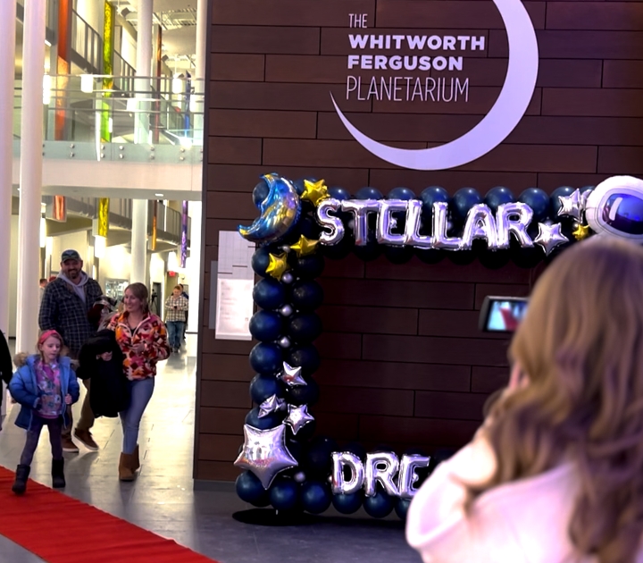 Families arriving at the Whitworth Ferguson Planetarium for the telescope distribution