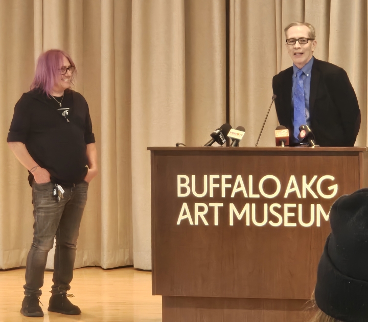 Robby Takac and Anthony Chase speaking to a crowd